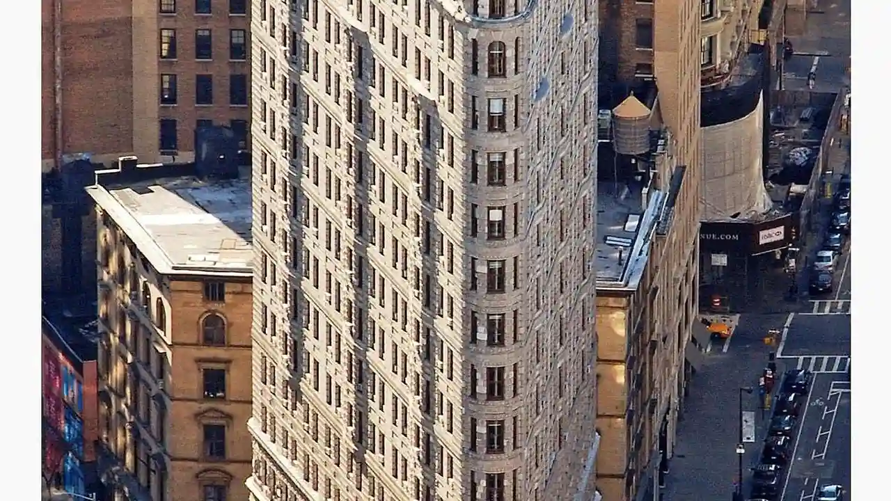 Close up on a plate of mashed potatoes, topped with baked pork chops with cream of mushroom soup, and a side of green beans.