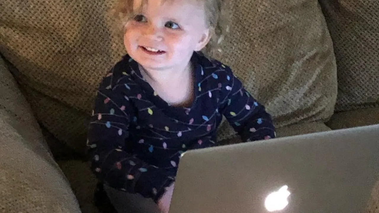 Close up on a plate of mashed potatoes, topped with baked pork chops with cream of mushroom soup, and a side of green beans.
