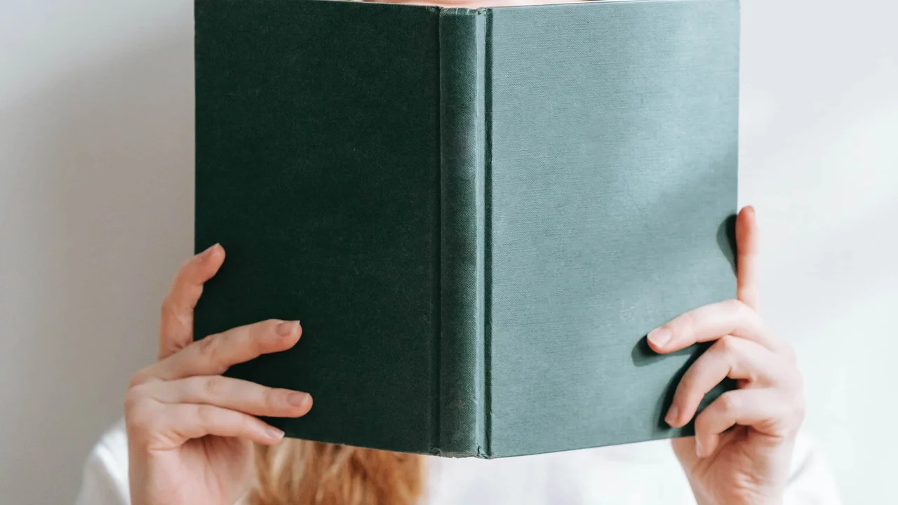 overhead view of corned beef sliced and on a platter with cabbage, potatoes, and carrots